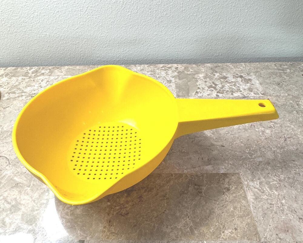 Vintage 1 quart Tupperware strainer with handle and pour spouts in bright yellow